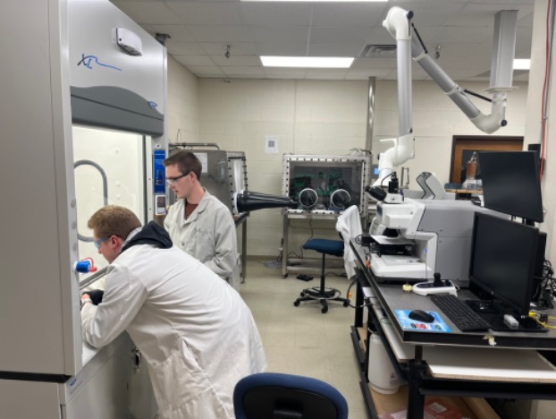 MODES laboratory with students working near gloveboxes and instruments